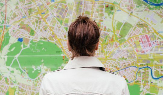 questions: lost woman stares at map